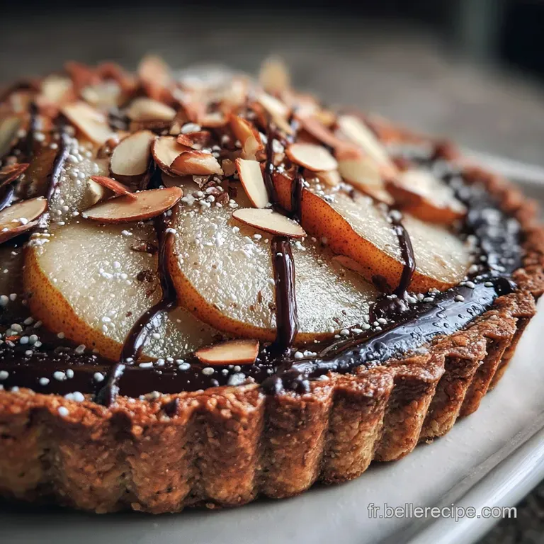 Slice of dark chocolate pear tart with almond cream filling, drizzled with chocolate sauce, artfully presented on a white ...